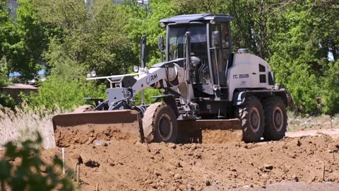 Grader working on road construction. Heavy Industrial Machines Build a Highway Stock Footage 130407273
