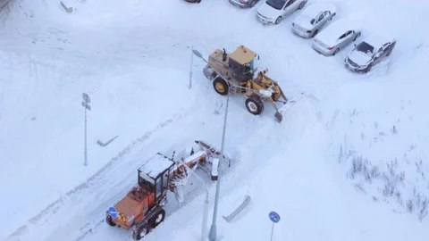 Graders clearing snow from a road Stock Footage 287601065
