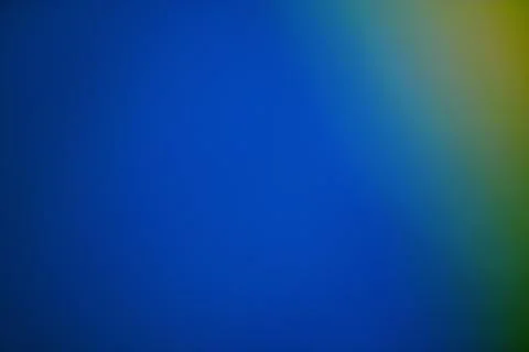 Gradient background from blue to yellow green creates a calming abstract scen Stock Photos