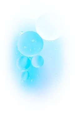 Gradient background in white and sky soft tones. Macro drops of oil on the Stock Photos
