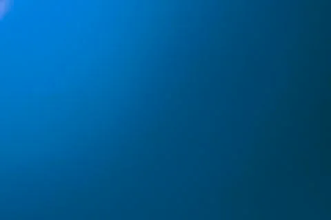 Gradient blue colored paper background. Stock Photos