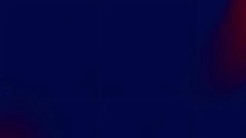 A gradient of dark blues and reds. Stock Photos