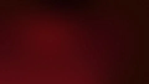 Gradient deep red backdrop with soft grain texture. Seamless loop background. 動画素材 309855534