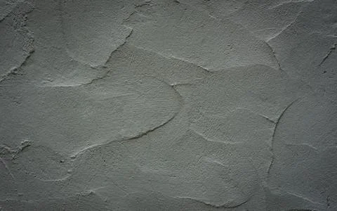 Gradient Grey walls with a rough surface from the use of a plastering trowel Photos