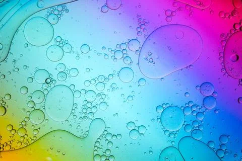 Gradient multicolored background with wet surface Stock Photos