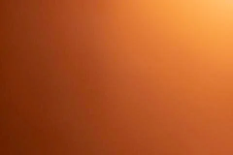 Gradient orange colored paper background. Stock Photos