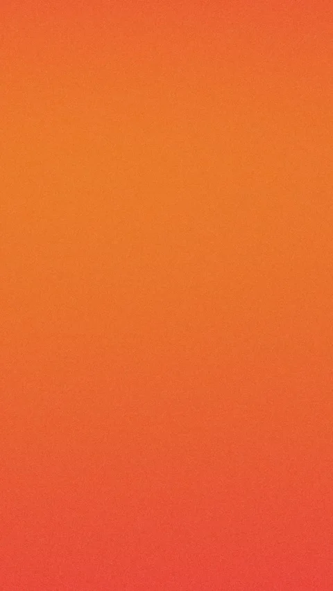 Gradient orange to red seamless loop background with grain texture, 4K. Stockbeeldmateriaal 309856000