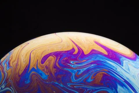 Gradient saturated colorful soap bubble black background Stock Photos