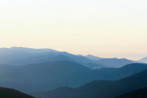 The gradient of a sky and mountains Stock Photos