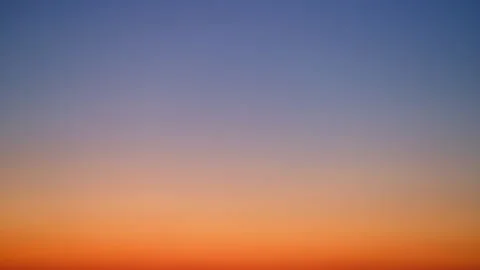 Gradient sky with blue and orange hues at sunset, time lapse. Natural background Video stock 306304611