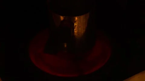 On a gradually heating and red-hot modern electric stove 動画素材 129711097