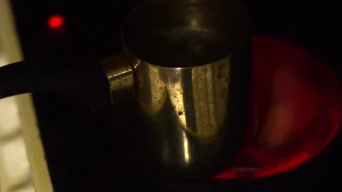 On a gradually heating and red-hot modern electric stove Stock-Footage 129711109