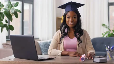 Graduate student with laptop and diploma at home Stock Footage