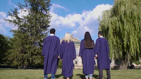 Graduate students throwing square hats up, popular tradition, higher education Stock Footage 78846443