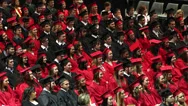 Graduates Raising Hands During Ceremony. Stock Footage