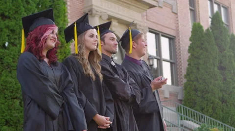 Graduates spraying silly string into crowd 스톡 동영상 67298703