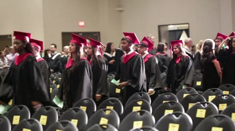 Graduating students walking into a hall Stock Footage 39838236