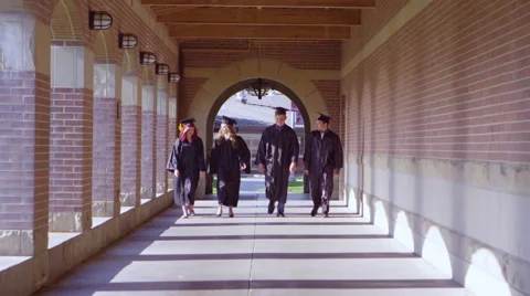 Graduating students walking through the hallway into blur Stock Footage 67298718