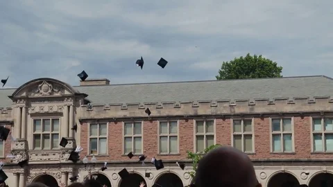Graduation cap flying in the air Stock-Footage 84748742