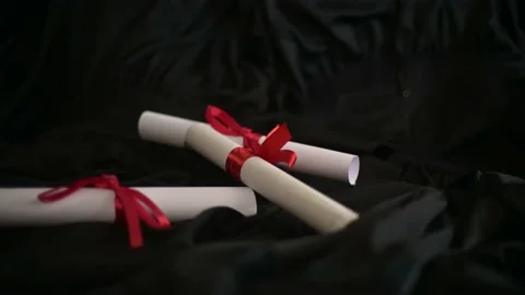 Graduation cap placed on a black academic gown,Education concept Видео 136530185