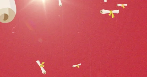 Graduation scrolls with yellow ribbons rotating over red background Stock Footage 304932013