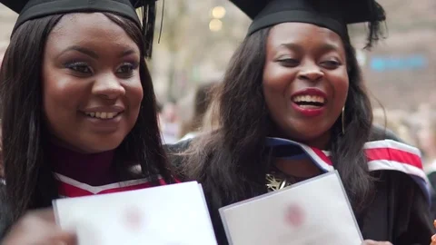 Graduation Success, Happy Black College Female Graduates Celebrate Together Stock Footage