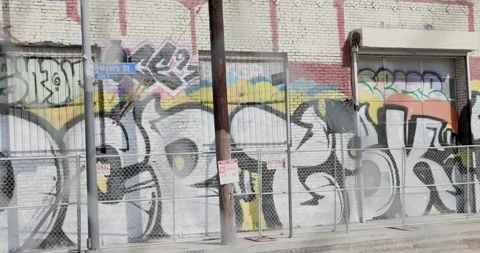 Graffit Industrial Building Through Chain Link Fence Stock Footage 250163307