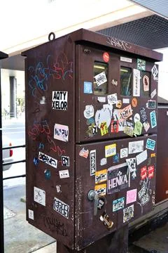 Graffiti affixed to public objects. Stock Photos