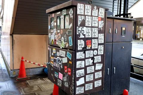 Graffiti affixed to public objects. Stock Photos