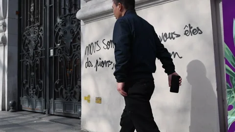 Graffiti After Protest in Paris Stock Footage 303061592