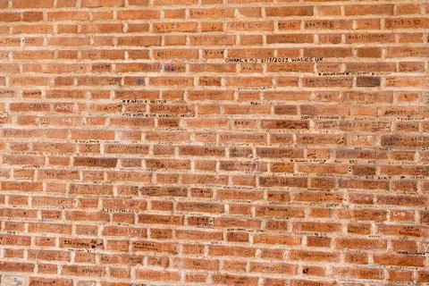 Graffiti and Lovers Names Written on Brick Wall at Casa di Giulietta in Veron Stock Photos