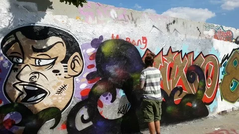 Graffiti art on the Berlin Wall Stock Footage 79841761