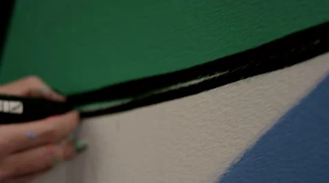 Graffiti artist drawing on wall. Stock Footage 63632286