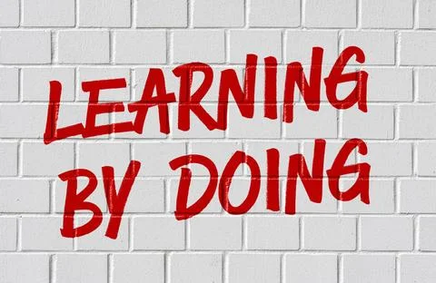 Graffiti on a brick wall - Learning by doing Graffiti on a brick wall - Le... 스톡 사진