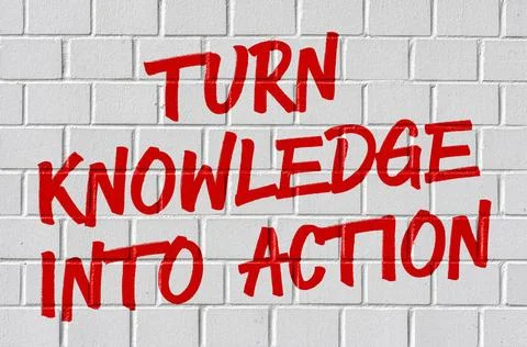 Graffiti on a brick wall - Turn knowledge into action Graffiti on a brick ... Stock Photos