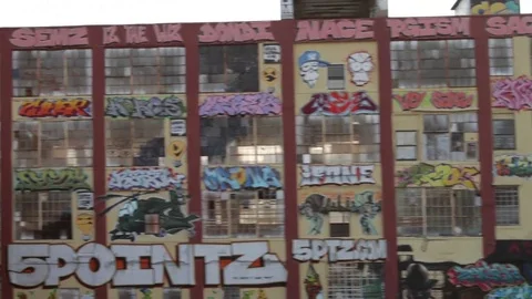 Graffiti on building from subway car Video stock 76747514