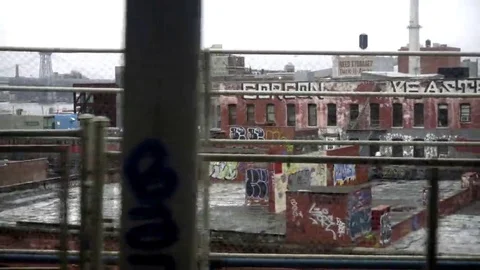 Graffiti On Buildings View From B Train Crossing Manhattan Bridge Brooklyn NYC Stock Footage 69256861