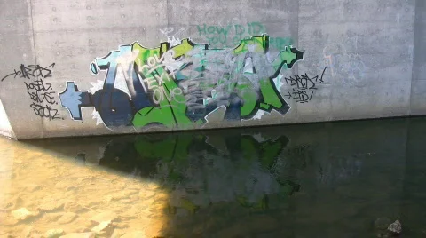Graffiti on concrete bridge support Stock Footage 606991