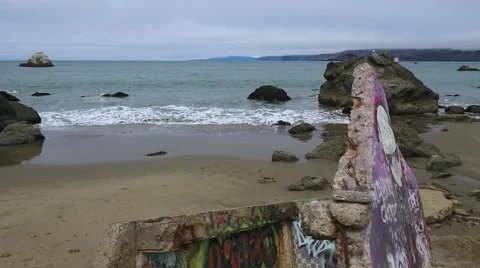 Graffiti Concrete Slabs on desolate beach cloudy day Stock-Footage 67164391