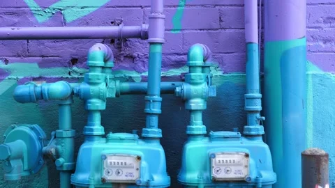 Graffiti covered and coloured gas meters on brick wall. Toronto, Canada. Stock Footage 165074341