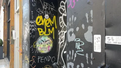 Graffiti covered building, corner of 10th Ave and west 19th street, Manhattan Stock Footage 203802442