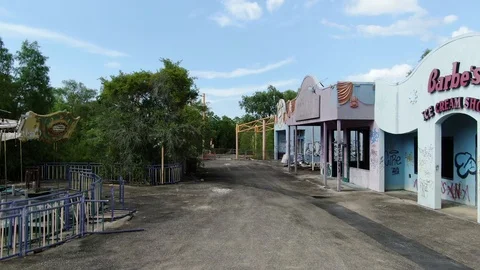 Graffiti covered ice cream stand on the Six Flags New Orleans midway Stock Footage 111650352