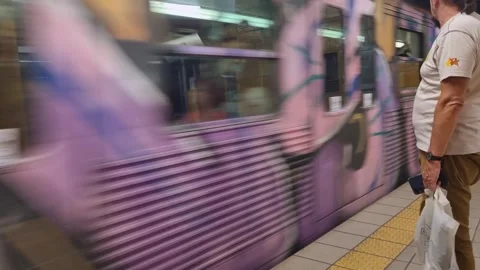 Graffiti-covered metro train arrives at Omonoia Station in Athens, Greece Stock Footage 319838858