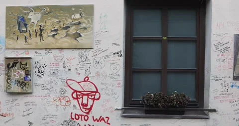 Graffiti covered wall and window in Uzupis art district, Vilnius Stock Footage 321048329