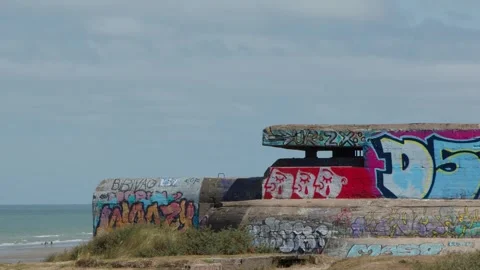 Graffiti-Covered WWII Bunker on Dunkirk Beach, France Vídeos de archivo 321047047