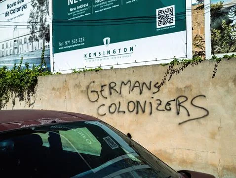 Graffiti Criticizing German Influence in Pollenca Stock Photos