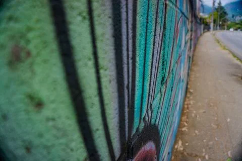 Graffiti on a green wall Stock Photos