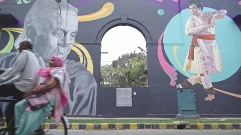 Graffiti, murals, and artwork on the streets of open-air public art Stock Footage 240729613
