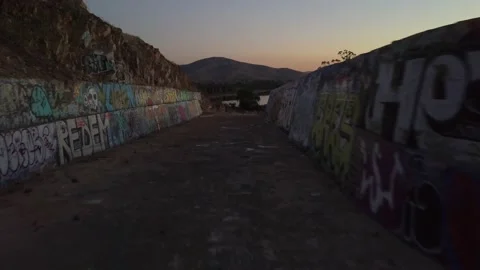 Graffiti on Old Spillway at Dusk Stockbeeldmateriaal 221375906