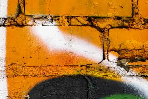 Graffiti painted on a brick wall texture. Stock Photos